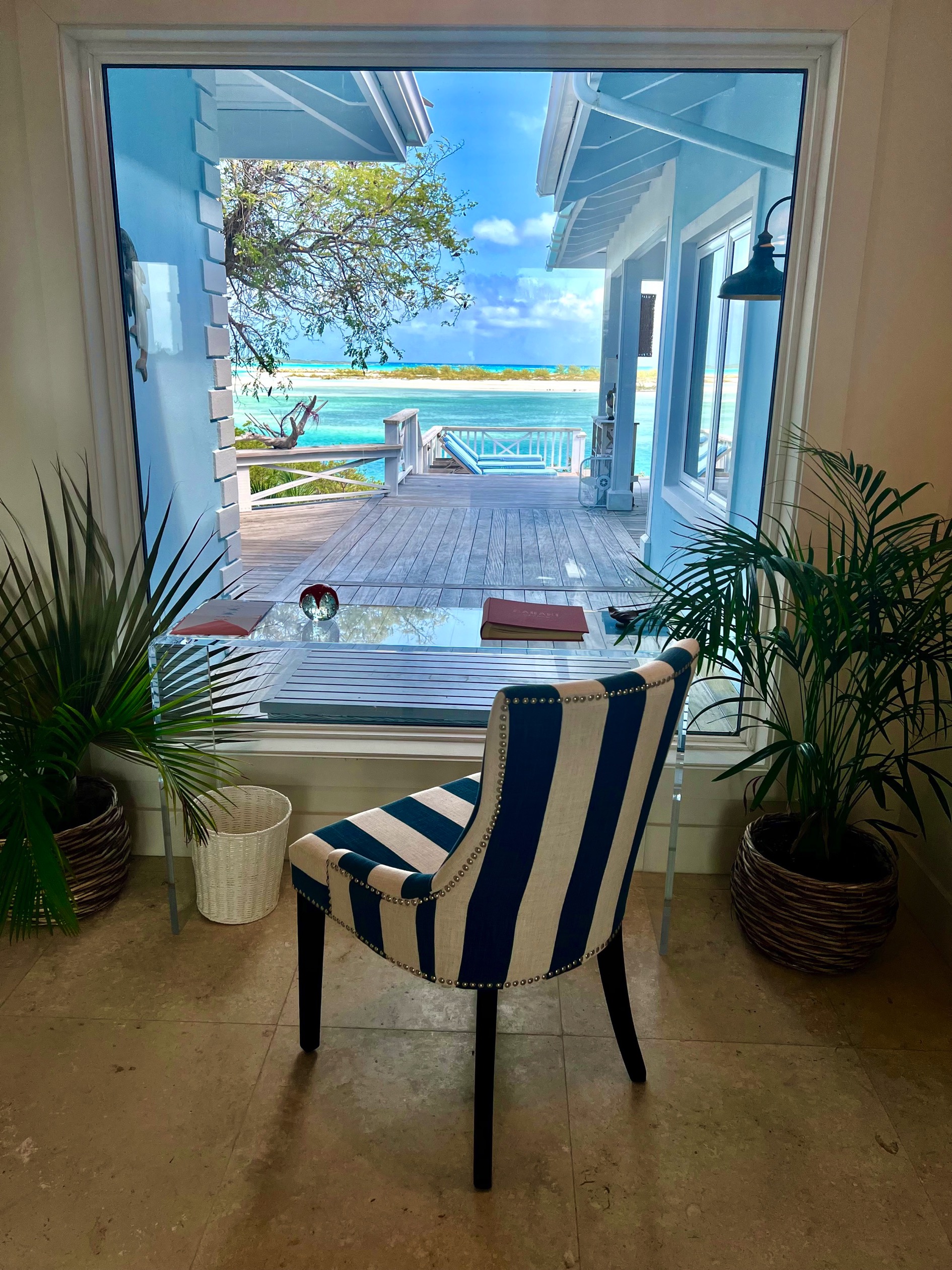 Outdoor lounge seating area with beach view Bakari House Great Exuma Bahamas